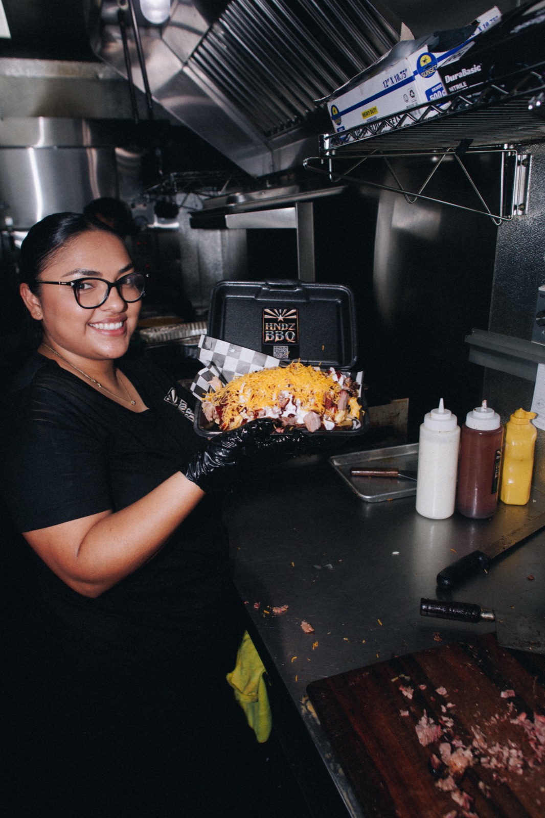 HNDZ BBQ team presenting a loaded barbecue plate